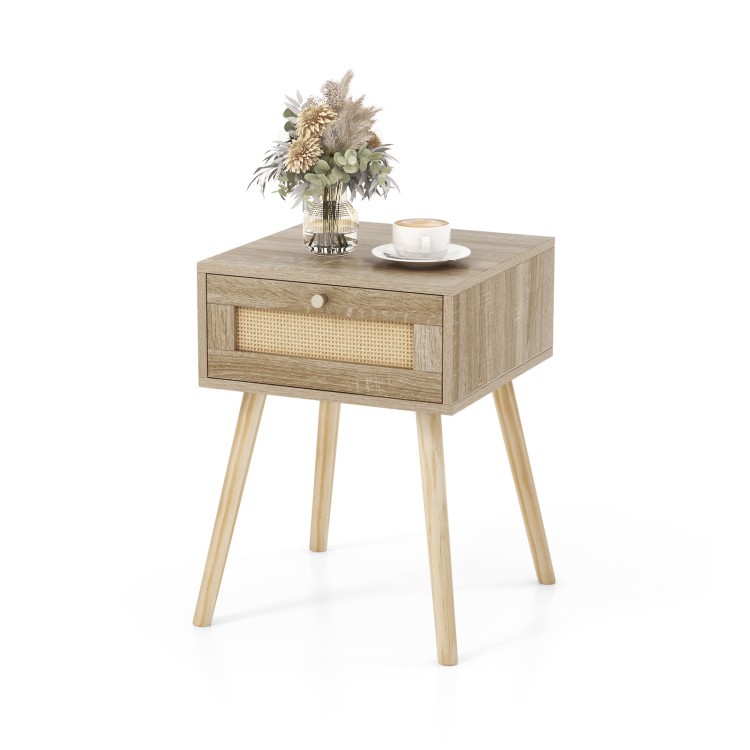 Rattan nightstand with drawer and natural wood legs, perfect for stylish bedroom storage and decor.