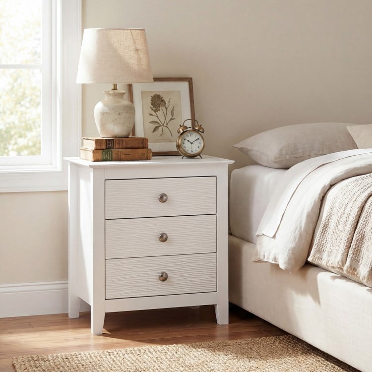 Modern Farmhouse 3-drawer nightstand in white with wood grain accents, perfect for bedside storage and decor.