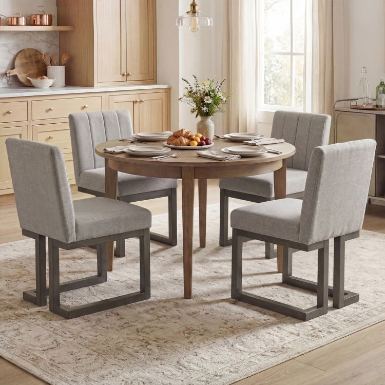 Set of 4 gray dining chairs with thick padded seats and rubber wood frames, perfect for modern farmhouse dining.