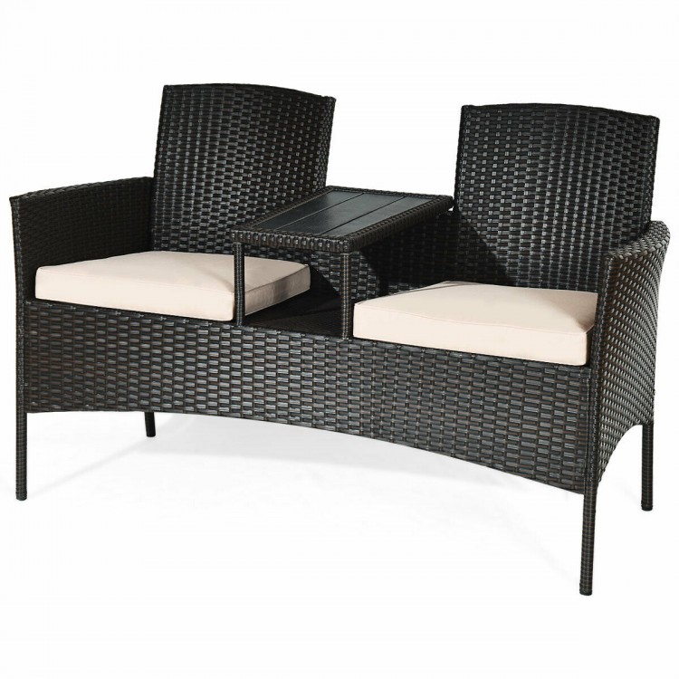 Modern patio conversation set featuring a built-in trapezoid coffee table, high-quality rattan, and beige cushions for.