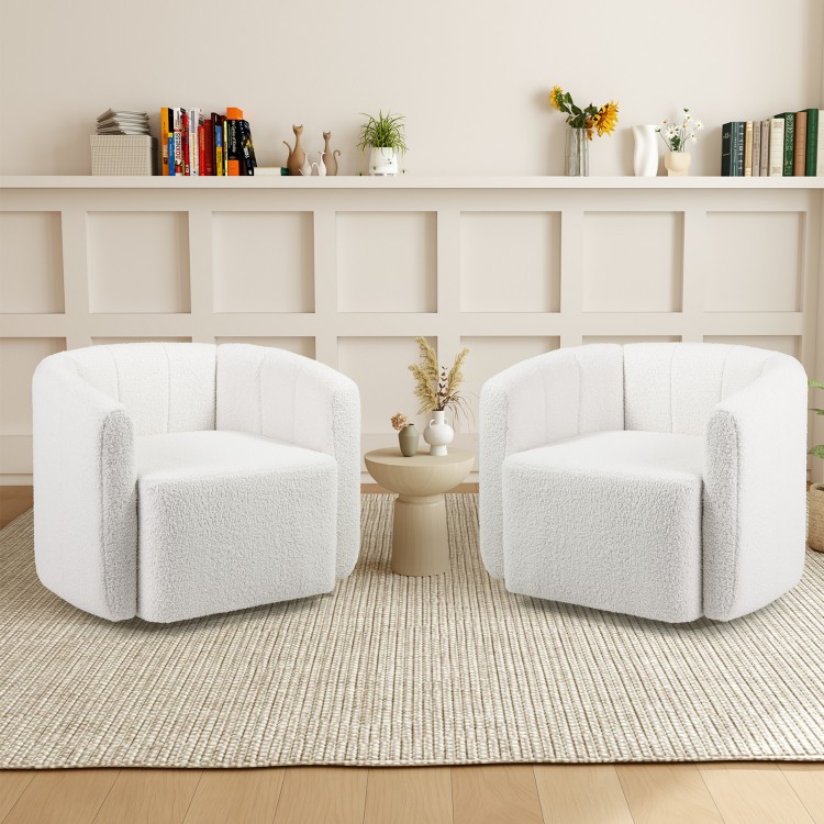Two white sherpa accent chairs with curved backrests, perfect for cozy living room seating and stylish decor.