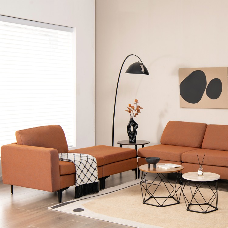 Close-up of the modular L-shaped sectional sofa's orange fabric texture, showcasing plush cushions and ergonomic design.