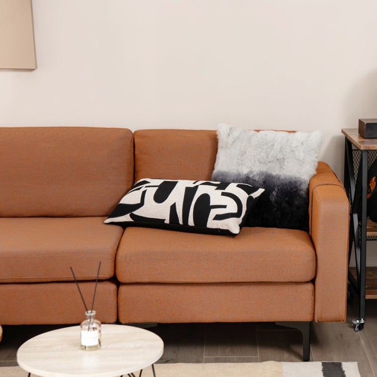 Modular L-shaped sectional sofa in orange with removable ottoman and plush cushions, perfect for cozy gatherings.