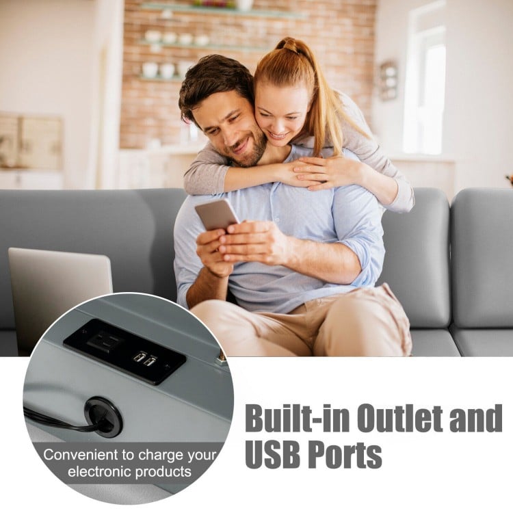 Light gray modular L-shaped sectional sofa with reversible ottoman and built-in USB ports for convenient charging.