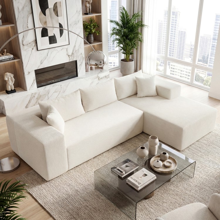 L-shaped modular sectional sofa in beige corduroy with deep seats, perfect for comfortable seating for four.