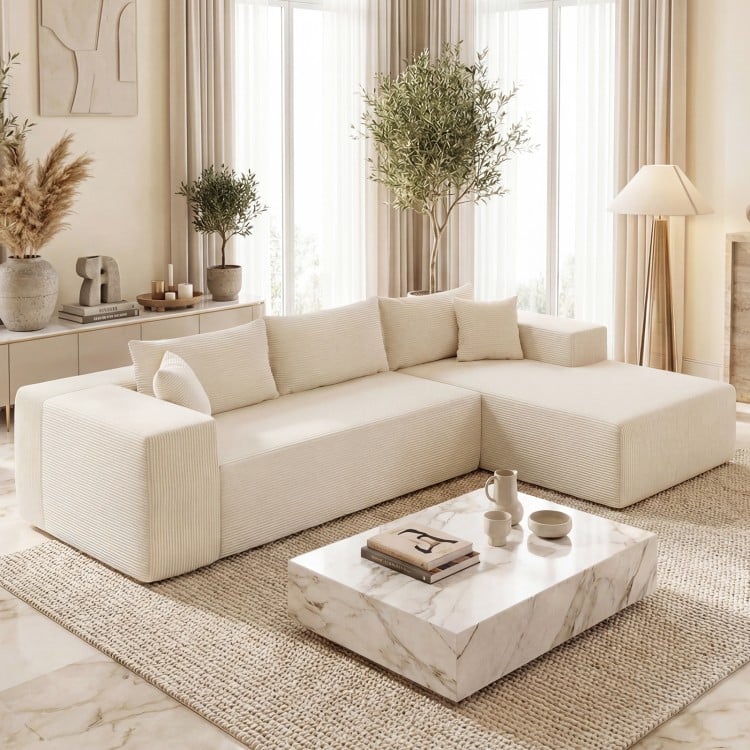 L-shaped modular sectional sofa in beige corduroy with deep seats, designed for ergonomic comfort and easy cleaning.