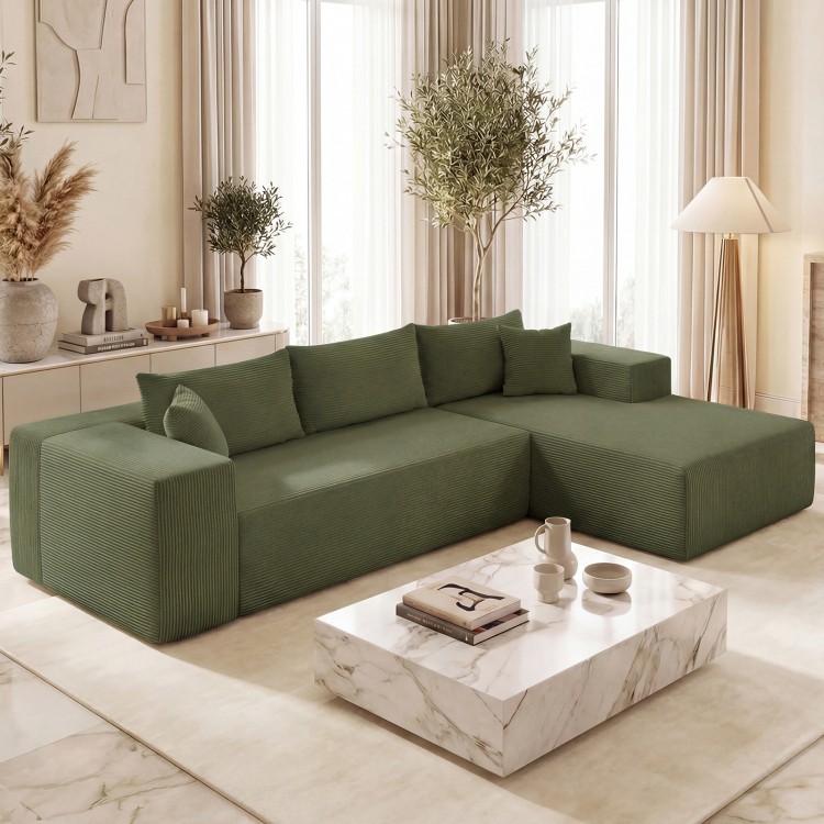L-shaped green modular sectional sofa with deep seats and corduroy upholstery, perfect for comfortable seating for four.