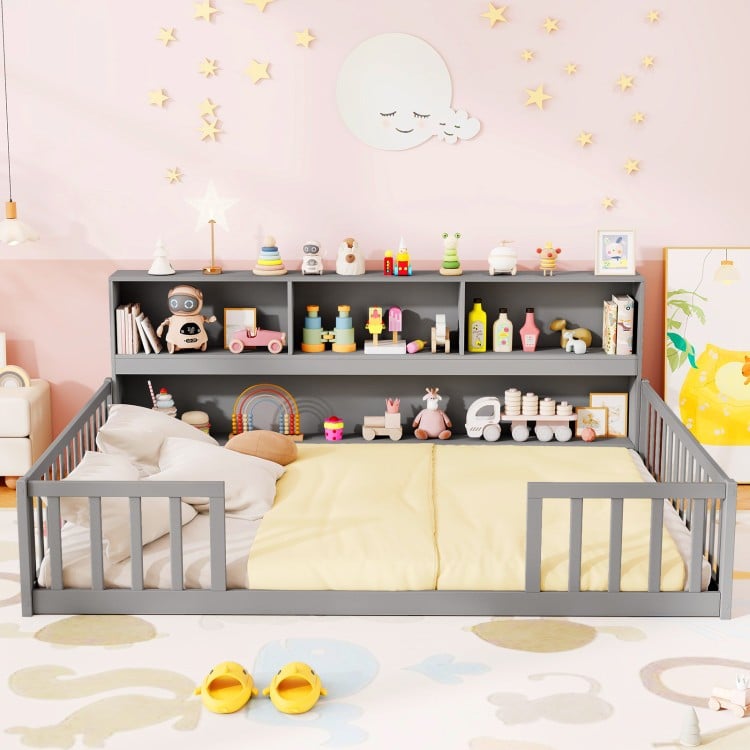Montessori twin floor bed with gray toy storage cabinet, promoting independence and organization in kids' rooms.