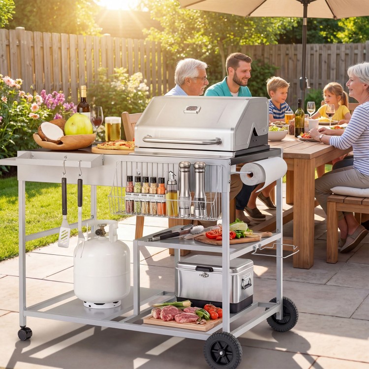Movable grill table with stainless steel condiment caddies, spacious tabletop, and wheels for easy outdoor BBQ setup.
