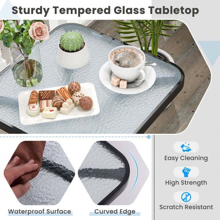 Tempered glass top patio table with black metal frame, featuring rounded corners and easy-to-clean surface for outdoor.