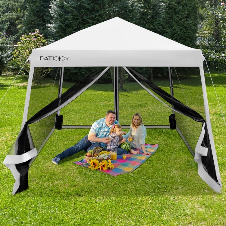 10x10 feet pop-up canopy with mesh sidewalls, adjustable height, and family enjoying a picnic in the backyard.