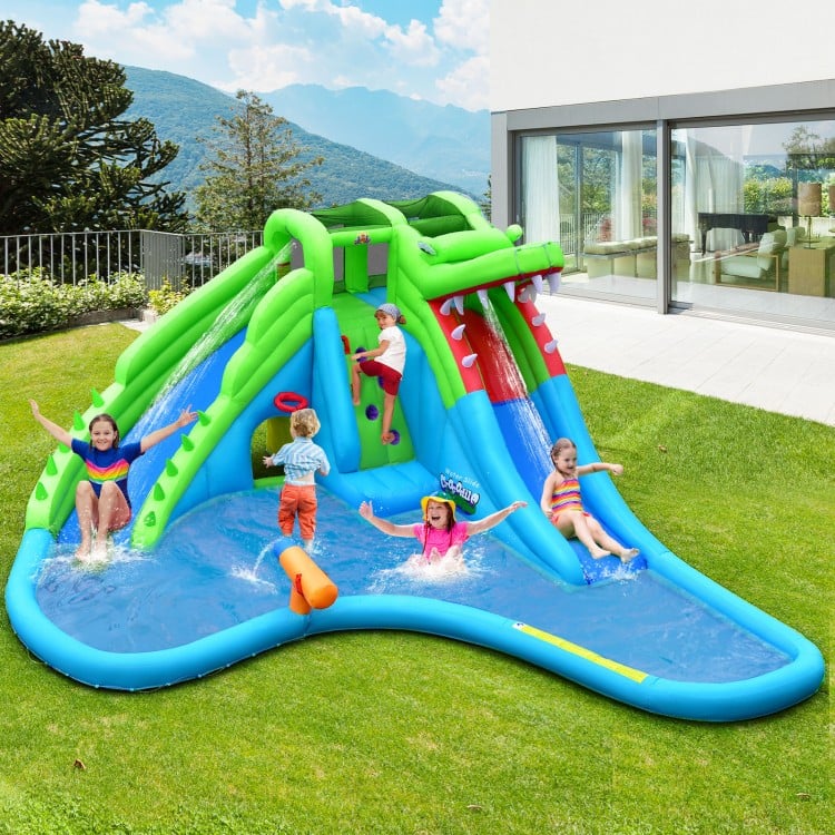 Inflatable 7-in-1 bounce house with water slides and splashing pool, perfect for outdoor fun with multiple activities.