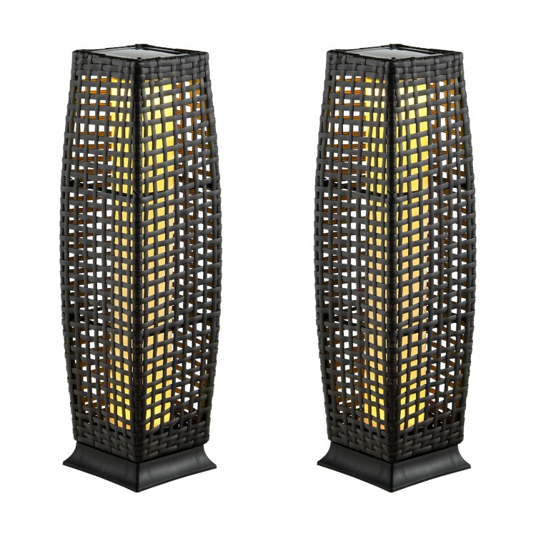 Two black solar-powered wicker floor lamps with warm yellow LED light, ideal for outdoor patio and garden use.