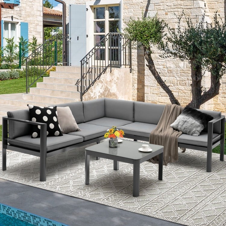 Gray aluminum patio coffee table with tempered glass top, complementing the sofa set for stylish outdoor entertaining.