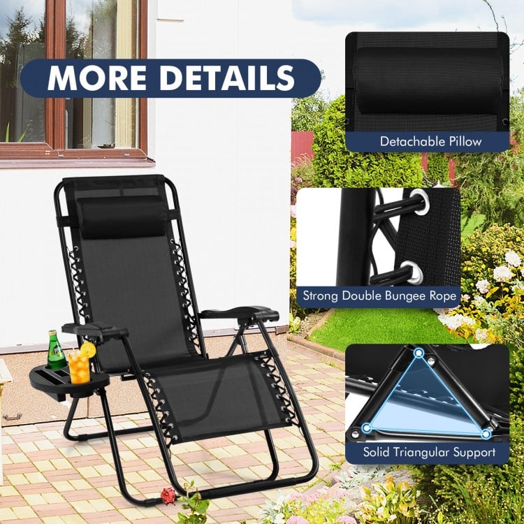 Black outdoor folding zero gravity reclining lounge chair with detachable pillow and utility tray for relaxation.