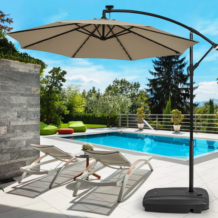Fillable universal offset umbrella base in black with cross base and wheels, ideal for poolside or patio use.