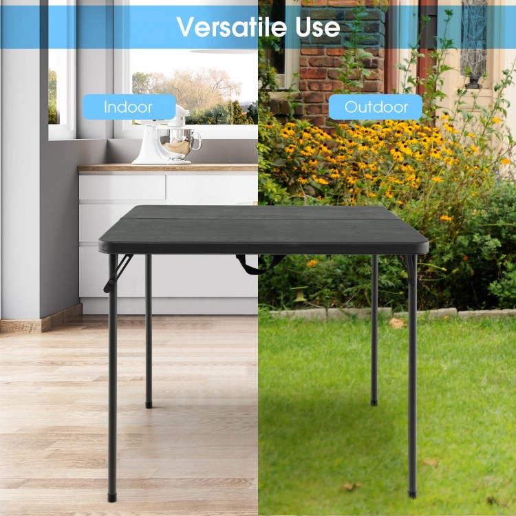Folding camping table with gray HDPE tabletop and rustproof steel frame, ideal for indoor or outdoor use.
