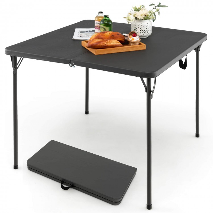Folding camping table in gray with all-weather HDPE tabletop and rustproof steel frame, perfect for outdoor use.