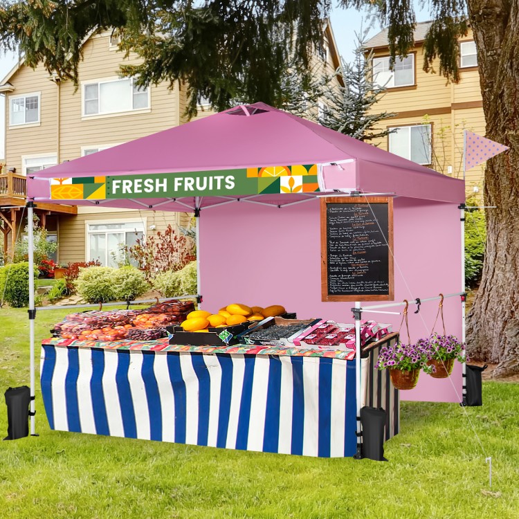 Foldable pink commercial pop-up canopy with adjustable height, ideal for outdoor events and featuring a banner strip.
