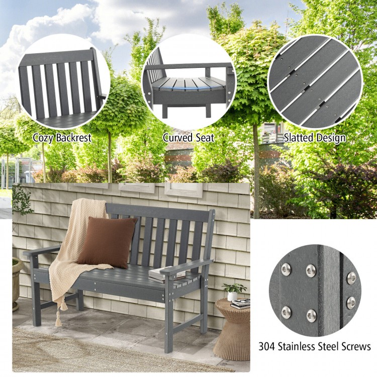 Gray 52-inch outdoor bench with backrest, armrests, and slatted design, made from all-weather HDPE for garden use.