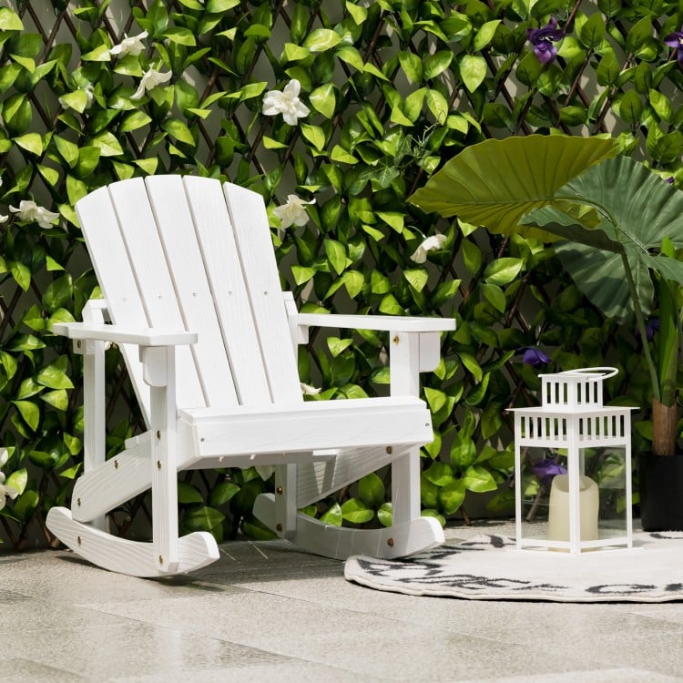 White outdoor wooden kid Adirondack rocking chair with slatted seat, perfect for relaxing in your garden or patio.