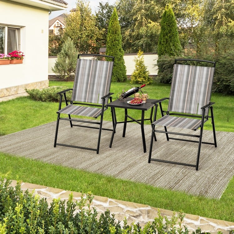 Set of 2 gray patio folding sling chairs with a small table, perfect for outdoor dining and relaxation.