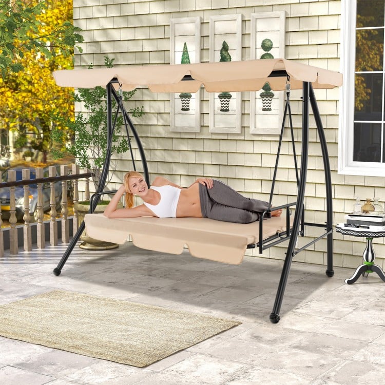 Convertible 2-seat outdoor swing chair with beige cushions and adjustable canopy, perfect for backyard relaxation.
