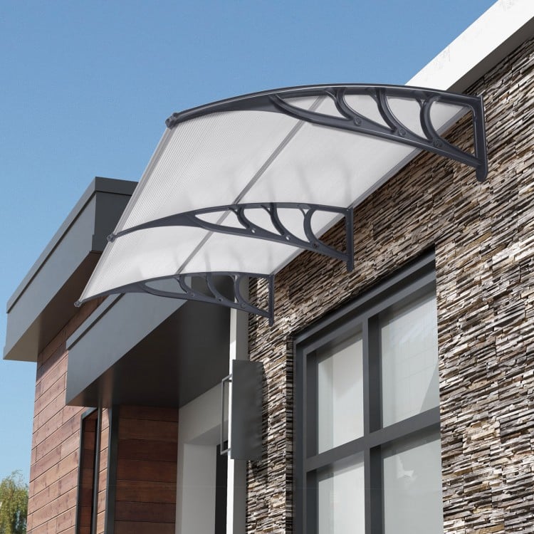 Gray outdoor front door patio awning with sturdy PC hollow panels for sunlight, rain, and wind protection.