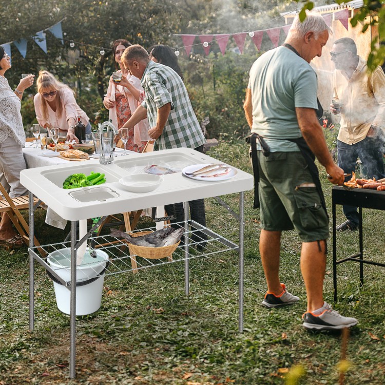 Folding fish cleaning table with double sinks, heavy-duty metal frame, ideal for camping and picnics.