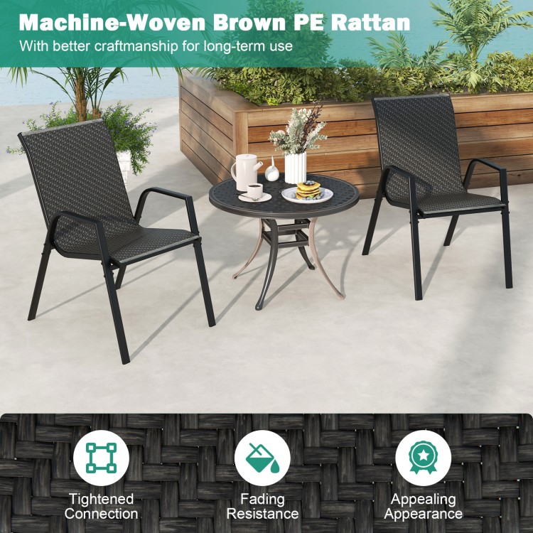 Two brown PE rattan dining chairs with a wicker woven seat and a round table, ideal for outdoor patio use.