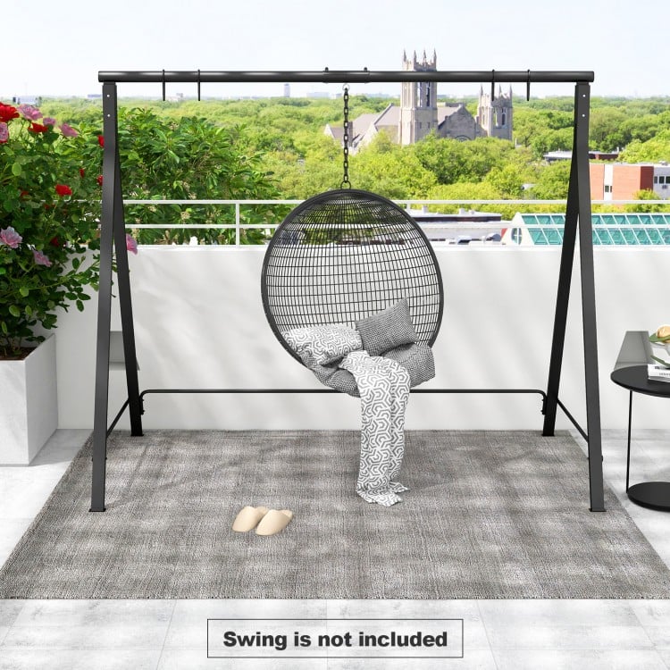 Patio metal swing stand in black with A-shaped structure, ideal for various swings, shown on a stylish patio setting.