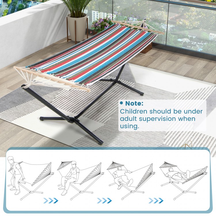 Multicolor hammock with stand, featuring breathable fabric and sturdy metal frame, ideal for garden or patio relaxation.