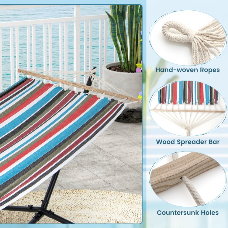 Multicolor hammock with stand featuring hand-woven ropes and wood spreader bar, ideal for garden or patio relaxation.