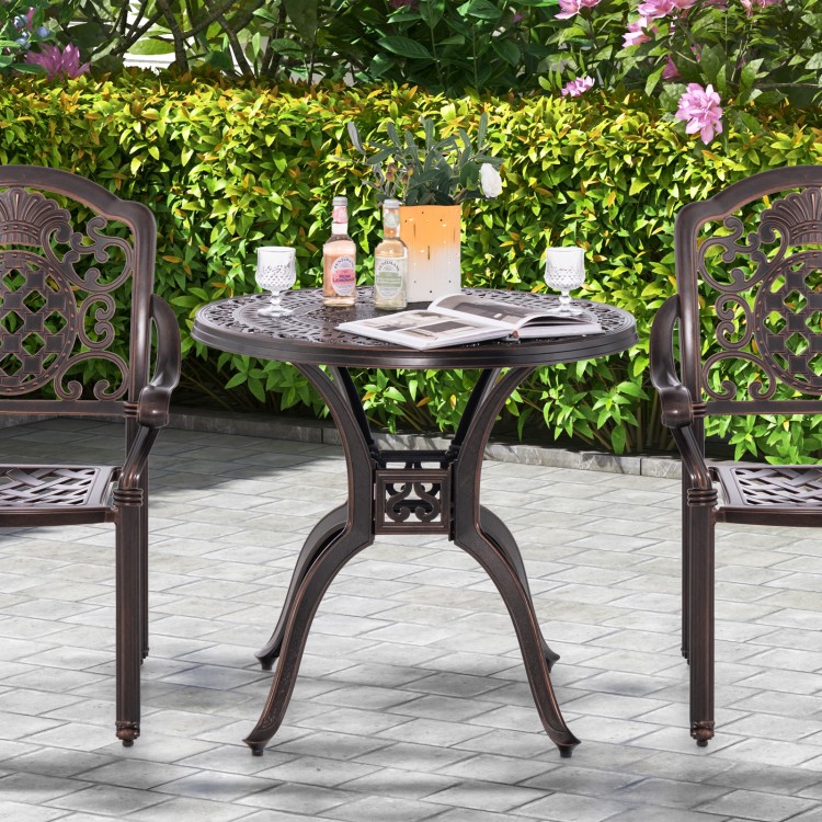 Round 31.5-inch cast aluminum patio dining table with umbrella hole, featuring elegant design for outdoor use.