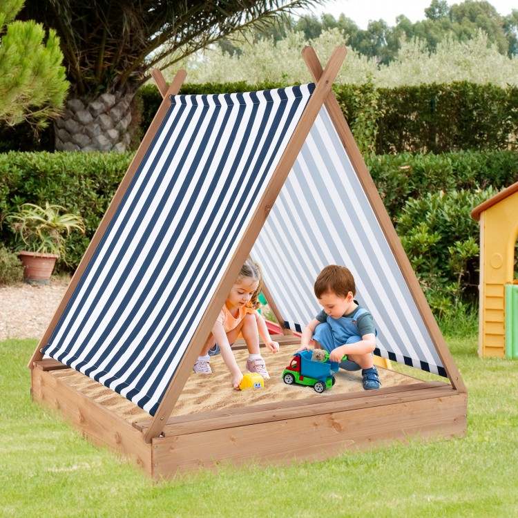Kids playing in a 49 x 48 inch wooden sandbox with cover and benches, perfect for outdoor fun in the backyard.
