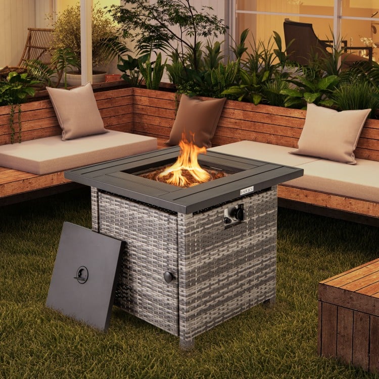 29-inch gray propane rattan firepit table with lava rocks, featuring a secure lid and adjustable flame for outdoor.