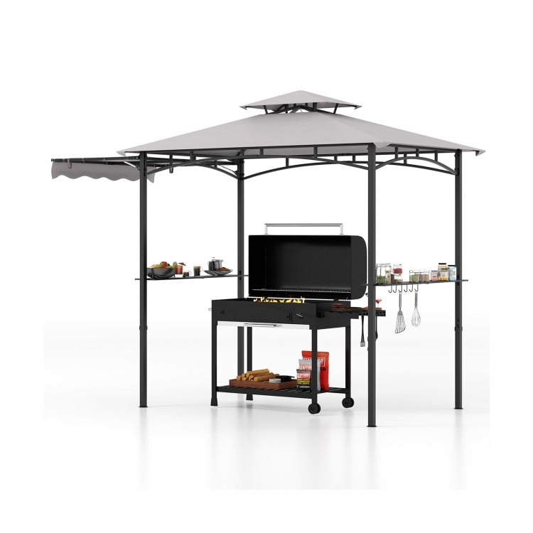 Grill gazebo with double-tiered gray canopy, side awning, and shelves for outdoor cooking and shade coverage.