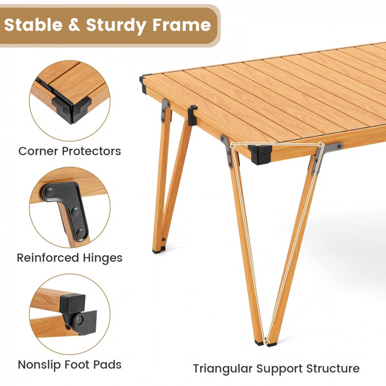 Folding camping table with a waterproof brown surface, sturdy frame, and triangular support for picnics and camping.