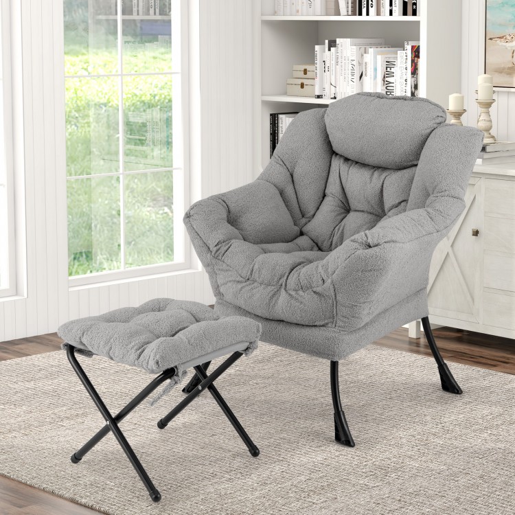 Gray modern accent chair with folding footrest, ergonomic design, and soft head pillow for ultimate relaxation.