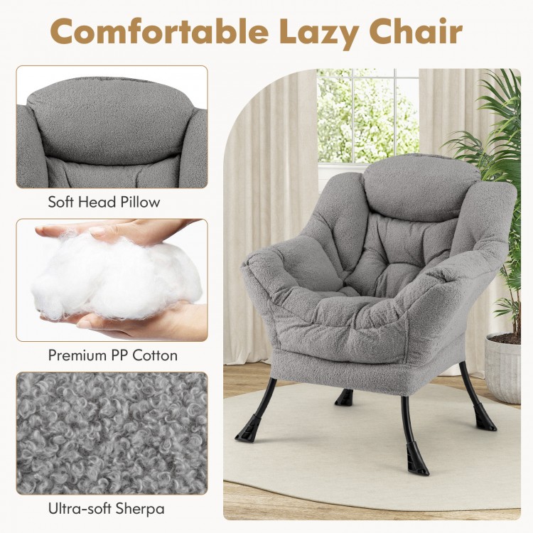 Modern accent chair in gray with soft head pillow, ergonomic design, and folding footrest for versatile comfort.