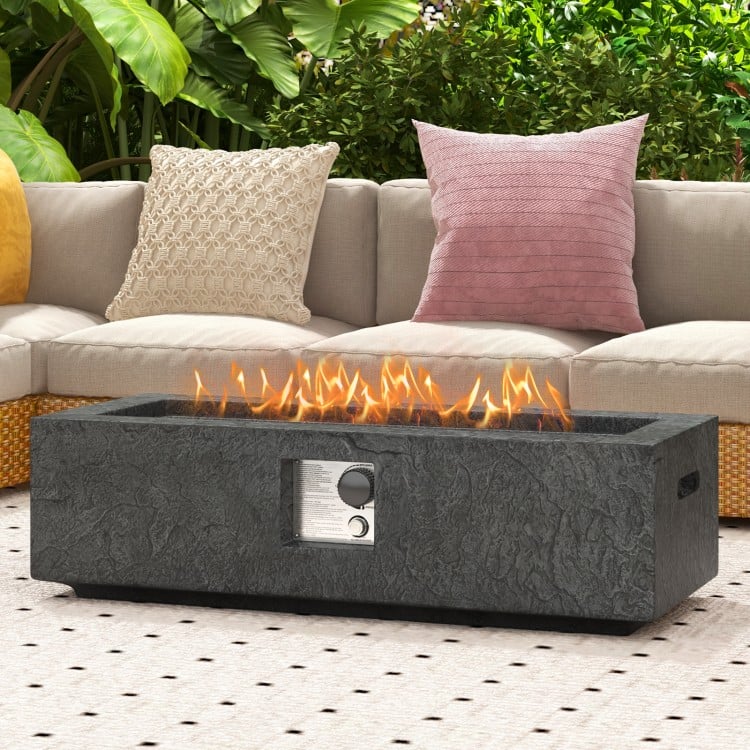42.5-inch fire pit table with stainless steel burner, featuring a textured magnesium oxide design for outdoor warmth.