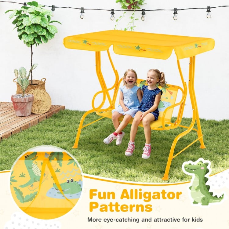 Yellow 2-seater kids patio swing with adjustable canopy and fun alligator patterns, perfect for outdoor play.