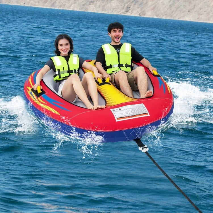 Inflatable towable tube for 1-2 persons with cockpit seating, durable PVC, and padded handles for water sports fun.