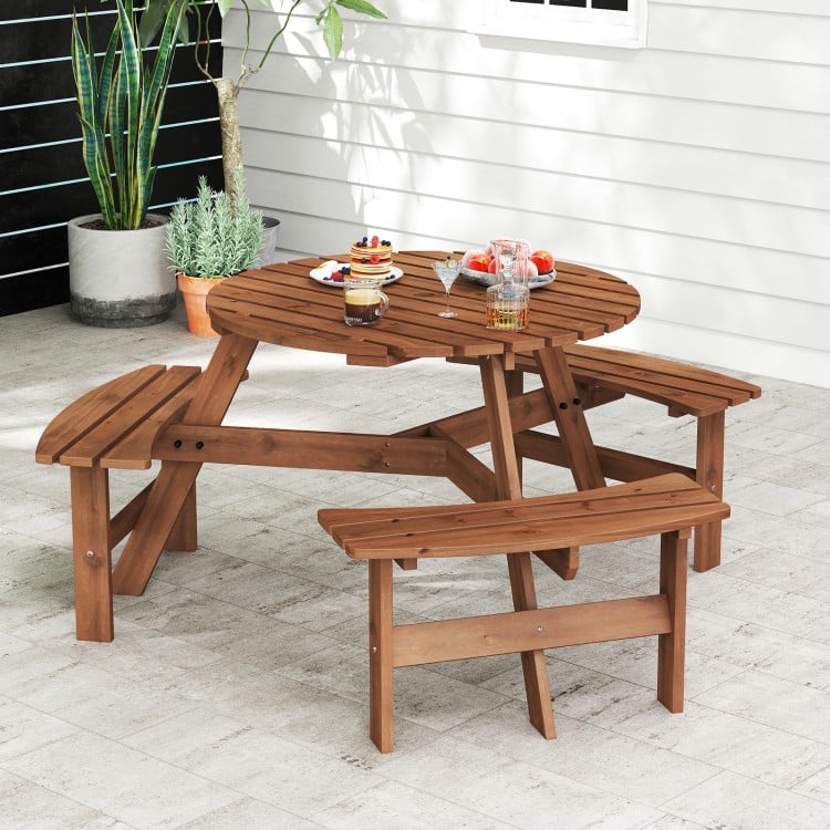 Round picnic table set in brown fir wood with 3 built-in benches, ideal for outdoor dining and gatherings.