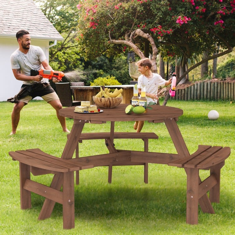Round picnic table set in brown fir wood with 3 built-in benches, perfect for outdoor meals with family and friends.