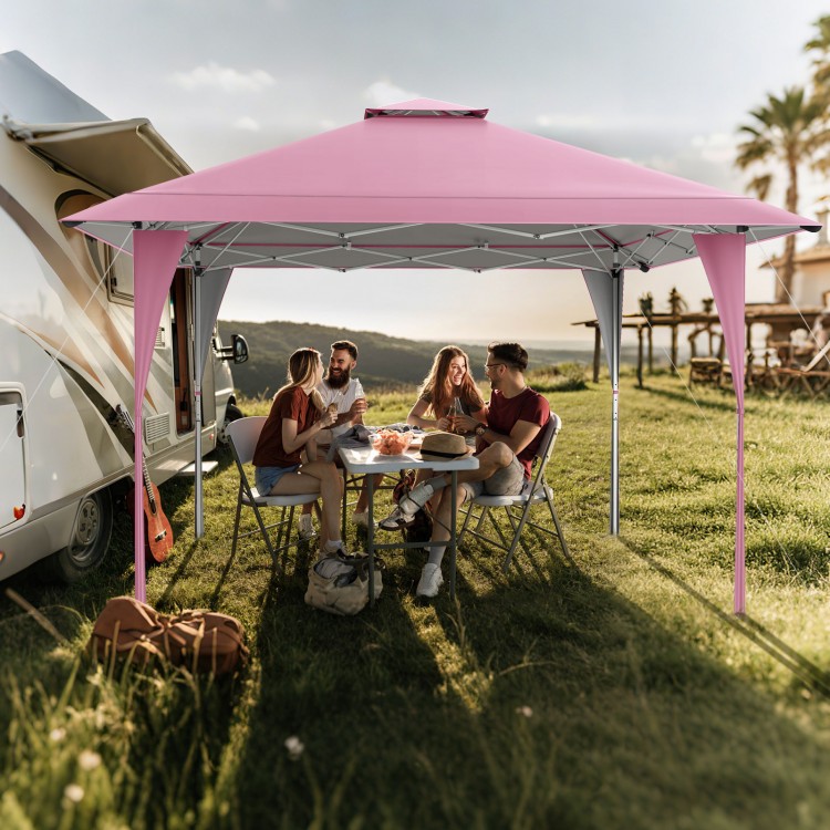 Pink 13 x 13 ft pop-up gazebo providing shade for outdoor gatherings, featuring extended eaves and sturdy support.
