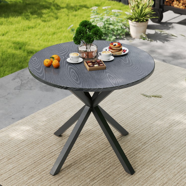 Round patio bistro table with wood-like top and X-shaped legs, perfect for outdoor gatherings in the garden.