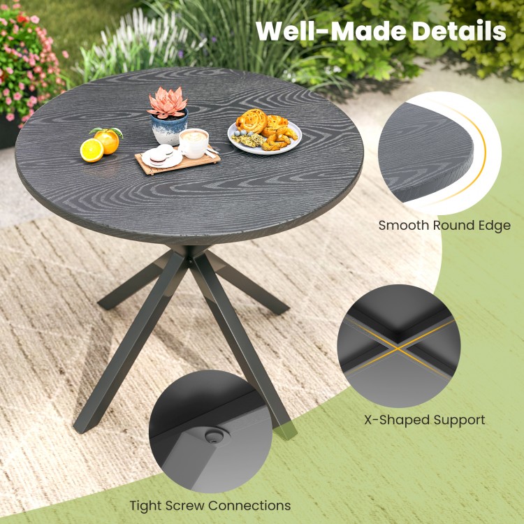 Round patio bistro table with wood-like top and X-shaped legs, perfect for 4-6 people in outdoor settings.