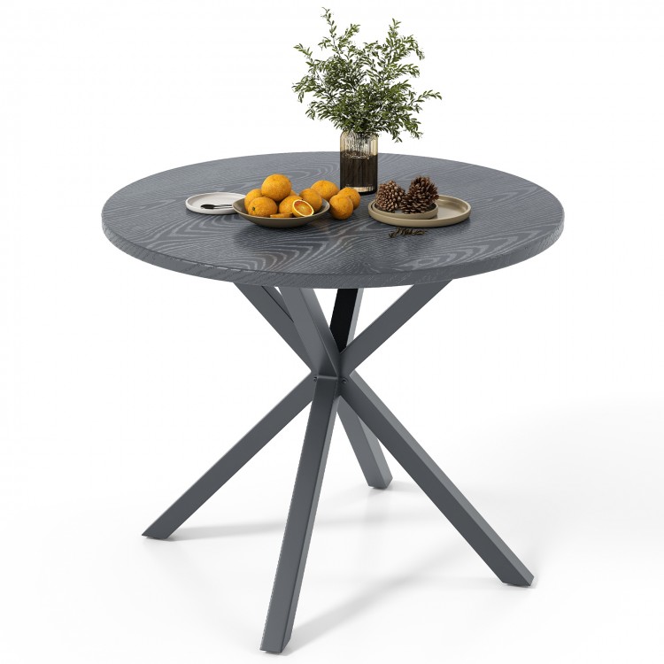 Round patio bistro table with a wood-like top and gray X-shaped legs, suitable for 4-6 people, perfect for outdoor use.