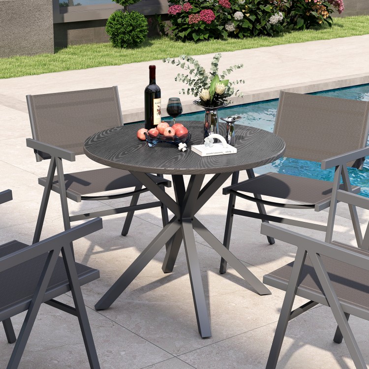 Round patio bistro table with wood-like top and X-shaped legs, suitable for 4-6 people, perfect for outdoor gatherings.